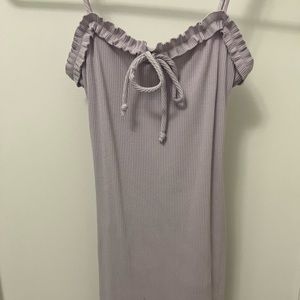 Spaghetti strap mini dress with tie detail.